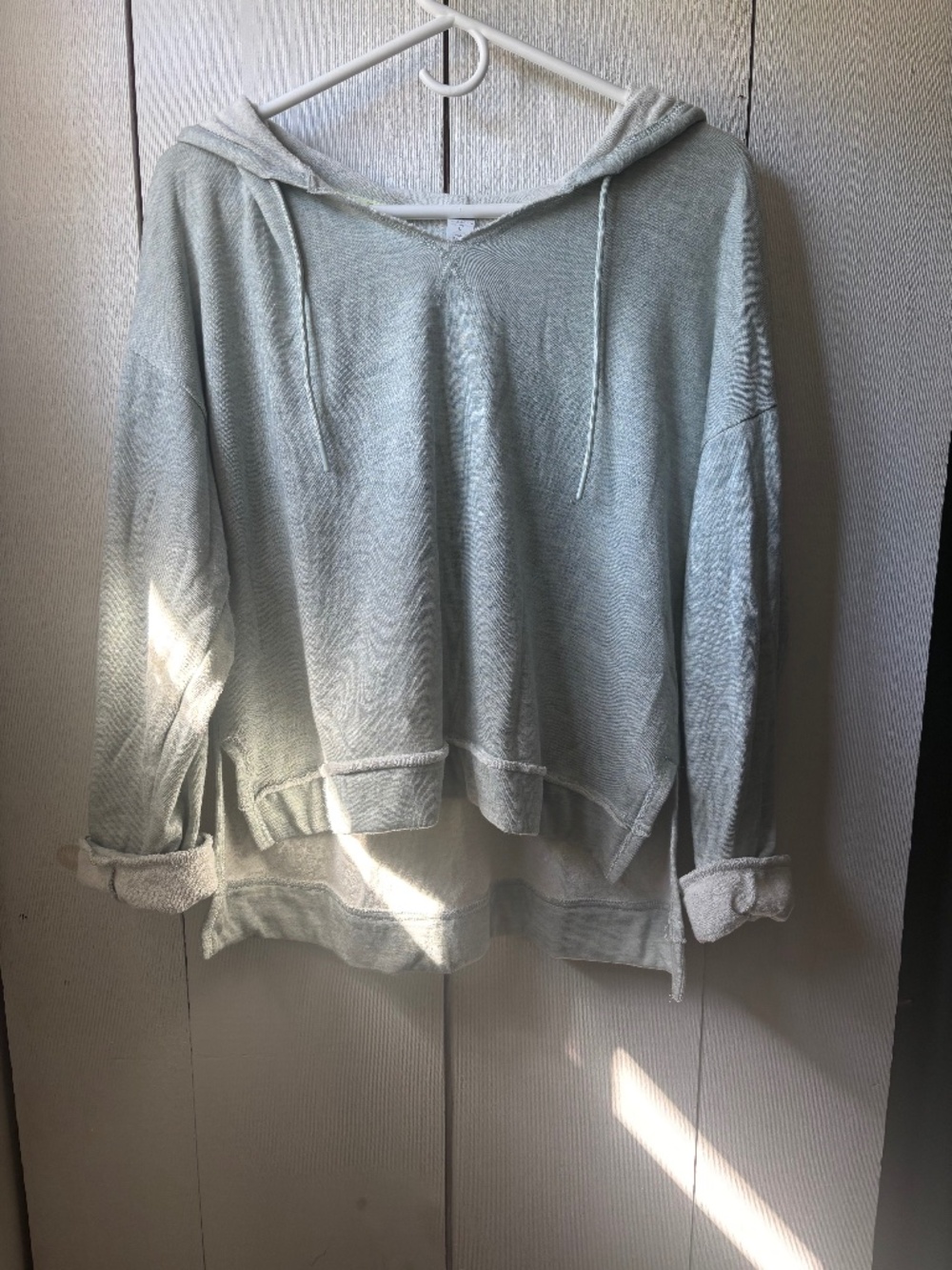 Woman’s light green sweatshirt